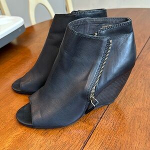 Black open toed zipper pumps